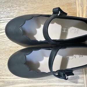 Black scalloped Mary Jane’s